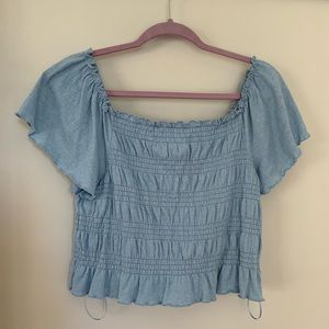 Ruched blue flowy sleeve off-the-shoulder crop top.